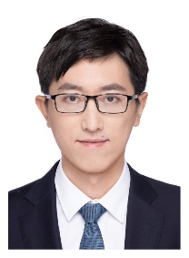 A person wearing glasses and a suitDescription automatically generated with medium confidence